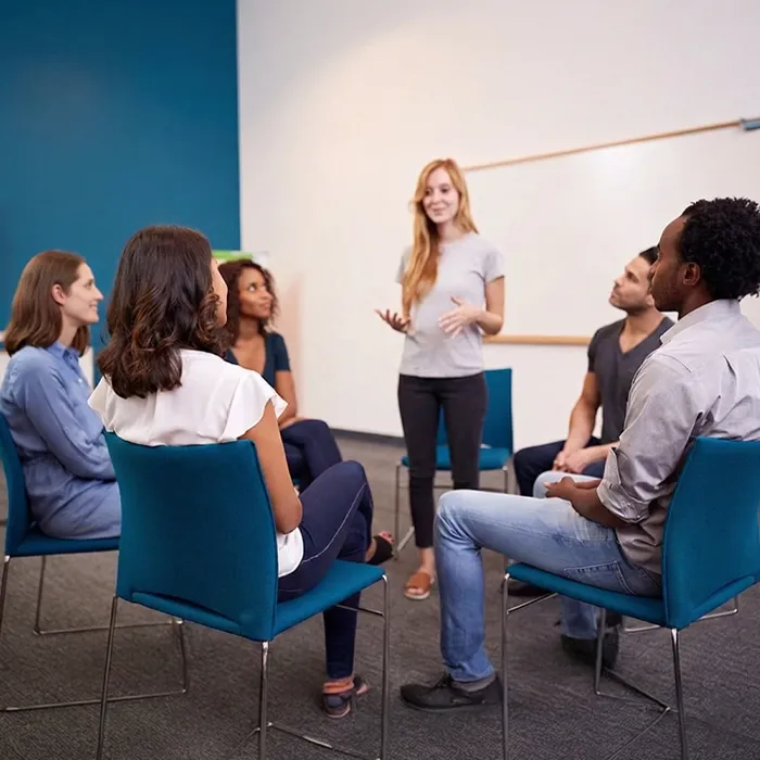 Facilitator leads group discussion in a counseling circle