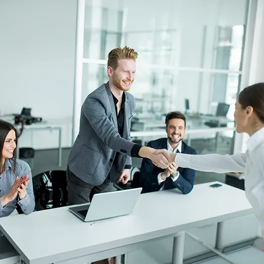 Business handshake during office meeting