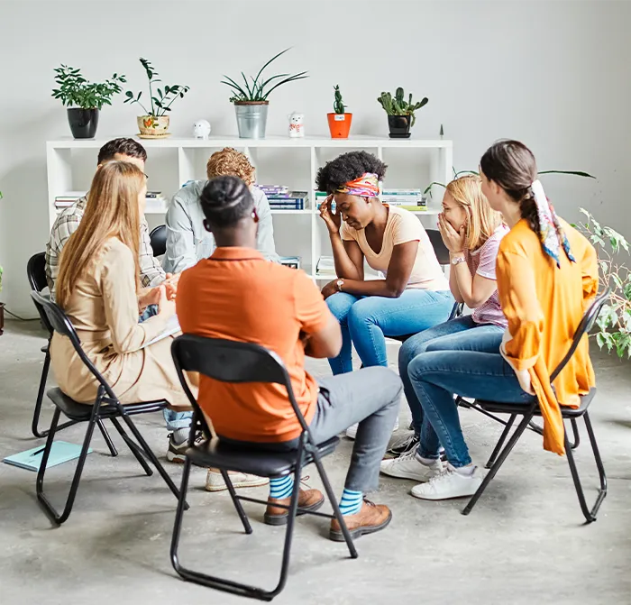 Support group listens as woman shares emotions